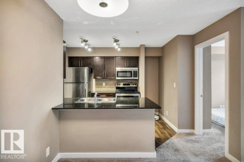 208 12035 22 Avenue, Edmonton, AB - Indoor Photo Showing Kitchen With Stainless Steel Kitchen With Double Sink