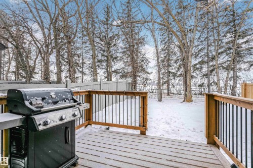 Snow covered deck featuring grilling area and a fenced backyard - 7322 Chivers Crescent, Edmonton, AB - Outdoor With Deck Patio Veranda