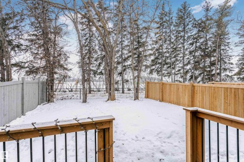 Snowy yard featuring a fenced backyard - 7322 Chivers Crescent, Edmonton, AB - Outdoor