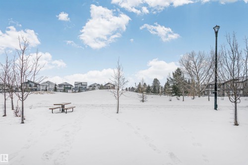 Snowy yard with a residential view - 7322 Chivers Crescent, Edmonton, AB - Outdoor With View