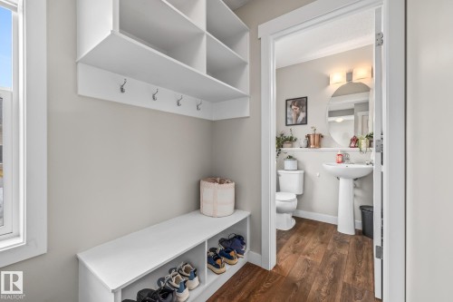 Mudroom featuring dark wood-style floors and a sink - 1315 Chappelle Boulevard, Edmonton, AB - Indoor