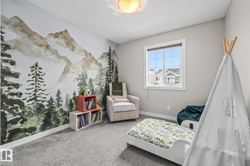 Bedroom featuring carpet floors and a textured ceiling - 1315 Chappelle Boulevard, Edmonton, AB - Indoor Photo Showing Other Room