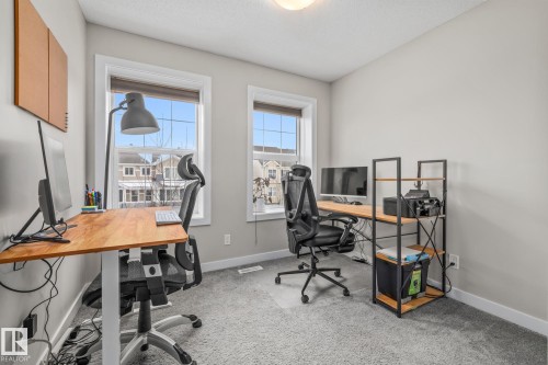 Bedroom with light carpet and a textured ceiling - 1315 Chappelle Boulevard, Edmonton, AB - Indoor Photo Showing Office