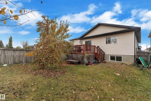 Back of property with a fenced backyard and a wooden deck - 3307 24 Avenue, Edmonton, AB - Outdoor