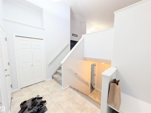 Stairway with tile patterned floors - 3307 24 Avenue, Edmonton, AB - Indoor Photo Showing Other Room