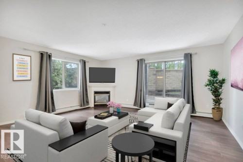 102 2903 Rabbit Hill Road, Edmonton, AB - Indoor Photo Showing Living Room With Fireplace