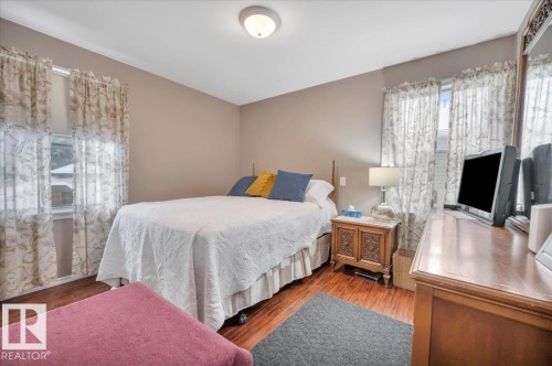 Bedroom featuring wood finished floors - 7934 81 Avenue Nw, Edmonton, AB - Indoor Photo Showing Bedroom