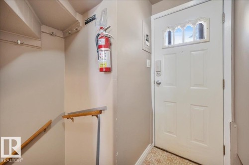 Foyer entrance with light flooring - 7934 81 Avenue Nw, Edmonton, AB - Indoor Photo Showing Other Room
