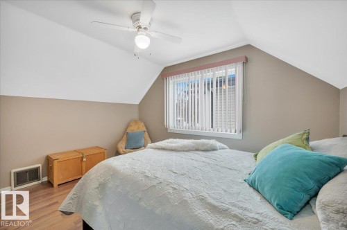 Bedroom featuring ceiling fan and wood finished floors - 7934 81 Avenue Nw, Edmonton, AB - Indoor Photo Showing Bedroom