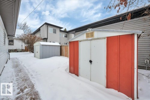 Snow covered structure with a storage shed - 7934 81 Avenue Nw, Edmonton, AB - Outdoor With Exterior