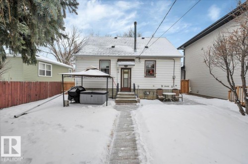 Snow covered house featuring roof with shingles - 7934 81 Avenue Nw, Edmonton, AB - Outdoor