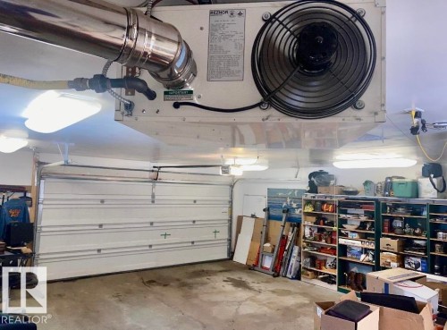 Garage featuring a garage door opener - 7934 81 Avenue Nw, Edmonton, AB - Indoor Photo Showing Garage