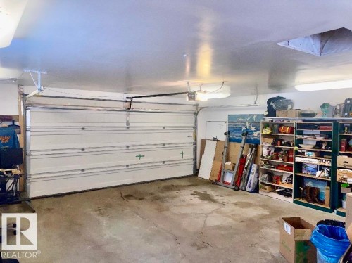 Garage with a garage door opener - 7934 81 Avenue Nw, Edmonton, AB - Indoor Photo Showing Garage