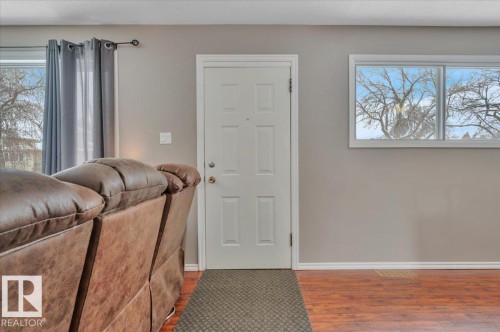 Entrance foyer featuring wood finished floors and baseboards - 7934 81 Avenue Nw, Edmonton, AB - Indoor Photo Showing Other Room