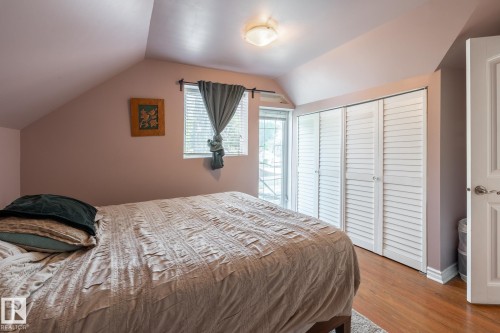 Bedroom with a closet and wood finished floors - 11415 85 Street, Edmonton, AB - Indoor Photo Showing Bedroom