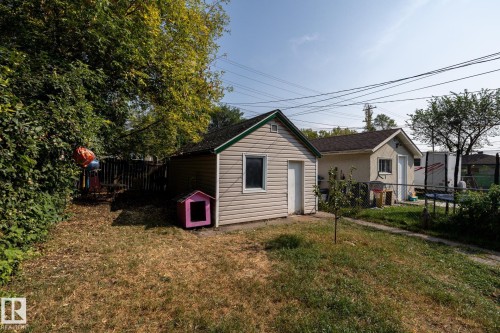 Back of property featuring a fenced backyard and an outbuilding - 11415 85 Street, Edmonton, AB - Outdoor