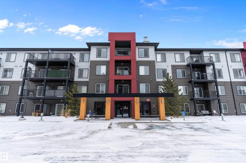 Snow covered property featuring a view of apartment building / complex - 231 344 Windermere Road, Edmonton, AB - Outdoor With Balcony With Facade