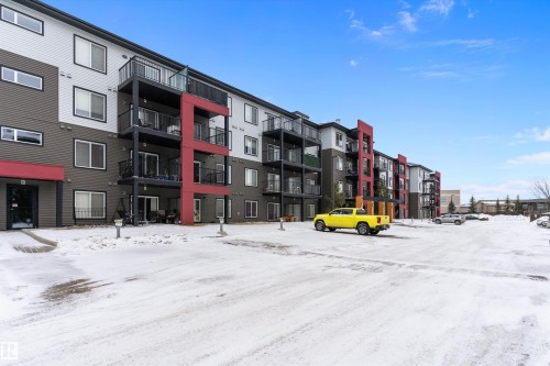 Snow covered property with a view of apartment building / complex - 231 344 Windermere Road, Edmonton, AB - Outdoor With Balcony With Facade