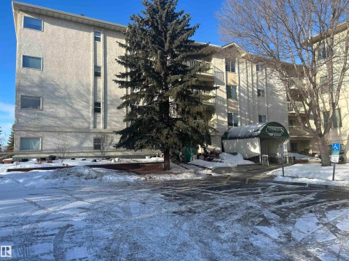 Snow covered property featuring a view of apartment building / complex - 202 18020 95 Avenue, Edmonton, AB - Outdoor