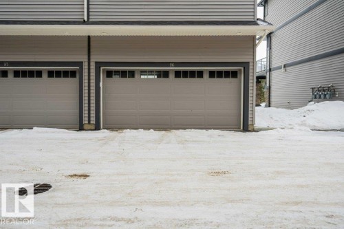 View of snow covered garage - 96 1530 Tamarack Boulevard, Edmonton, AB - Outdoor With Exterior