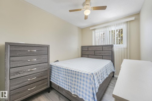 Bedroom with a ceiling fan and a textured ceiling - 2 Scarboro Place, St. Albert, AB - Indoor Photo Showing Bedroom