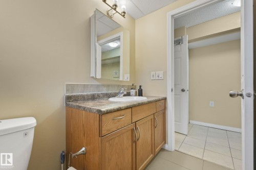 Bathroom with vanity and light tile patterned floors - 2 Scarboro Place, St. Albert, AB - Indoor Photo Showing Bathroom