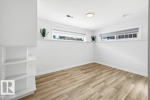 Spare room with light wood finished floors and baseboards - 7016 92A Avenue, Edmonton, AB - Indoor Photo Showing Other Room