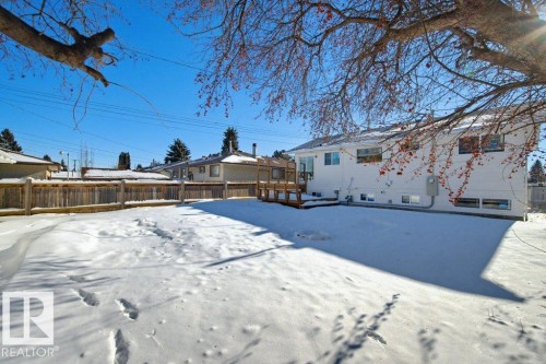 Snow covered house featuring a deck - 7016 92A Avenue, Edmonton, AB - Outdoor