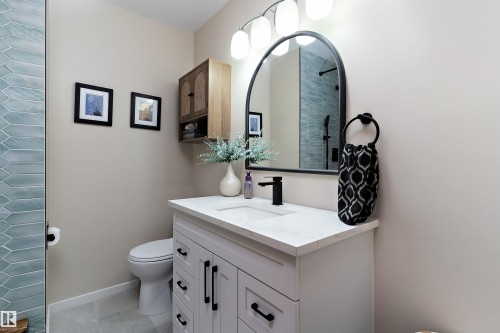Full bathroom with vanity, light tile patterned floors, and a tile shower - 7316 100 Avenue, Edmonton, AB - Indoor Photo Showing Bathroom