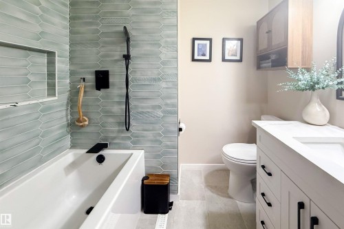 Full bathroom featuring vanity and baseboards - 7316 100 Avenue, Edmonton, AB - Indoor Photo Showing Bathroom