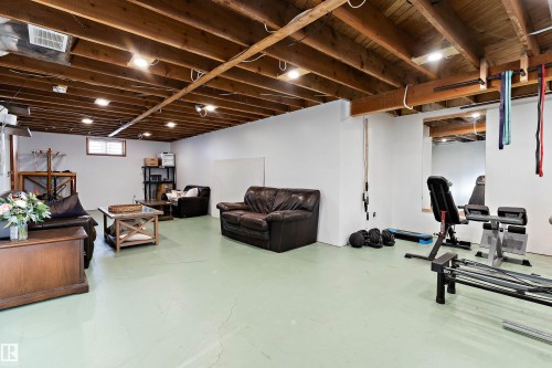 Workout room featuring finished concrete flooring - 7316 100 Avenue, Edmonton, AB - Indoor Photo Showing Basement