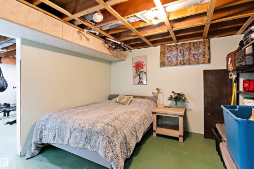 Bedroom with finished concrete flooring - 7316 100 Avenue, Edmonton, AB - Indoor Photo Showing Bedroom