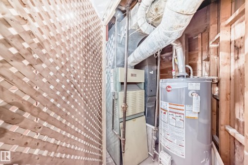 Utilities with gas water heater and heating unit - 13904 135 Avenue, Edmonton, AB - Indoor Photo Showing Basement