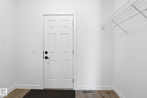 Walk in closet with light wood-style floors - 3234 Chernowski Way, Edmonton, AB - Indoor Photo Showing Other Room