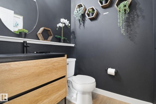 Bathroom with vanity and light wood-style flooring - 3234 Chernowski Way, Edmonton, AB - Indoor Photo Showing Bathroom