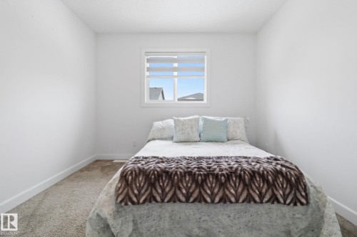 Carpeted bedroom featuring baseboards - 3234 Chernowski Way, Edmonton, AB - Indoor Photo Showing Bedroom