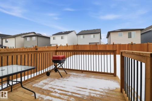 Wooden deck featuring a residential view and grilling area - 3234 Chernowski Way, Edmonton, AB - Outdoor With Exterior