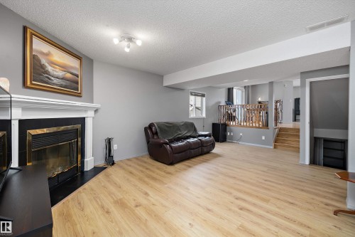 8007 160 Avenue, Edmonton, AB - Indoor Photo Showing Living Room With Fireplace