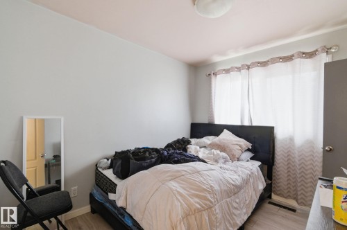 Bedroom with light wood-style flooring and baseboards - 13538 127 Street, Edmonton, AB - Indoor Photo Showing Bedroom