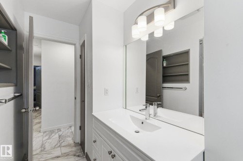 Bathroom featuring vanity and light marble finish floors - 13538 127 Street, Edmonton, AB - Indoor Photo Showing Bathroom