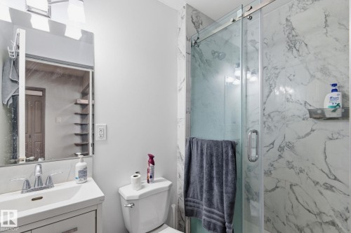 Bathroom with vanity and a marble finish shower - 13538 127 Street, Edmonton, AB - Indoor Photo Showing Bathroom