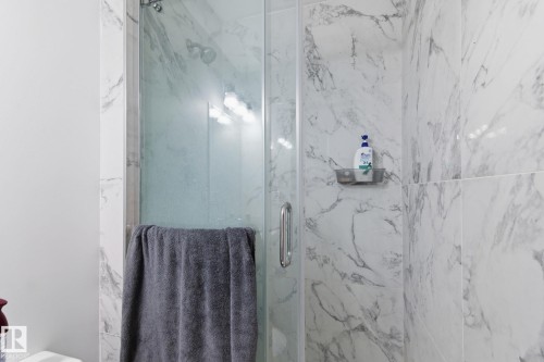 Full bath featuring a marble finish shower - 13538 127 Street, Edmonton, AB - Indoor Photo Showing Bathroom