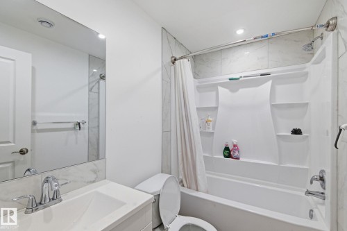 Bathroom with shower / tub combo with curtain, vanity, and recessed lighting - 13538 127 Street, Edmonton, AB - Indoor Photo Showing Bathroom