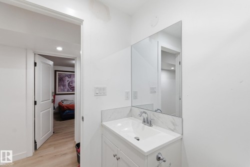 Bathroom featuring vanity, light wood-style flooring, and recessed lighting - 13538 127 Street, Edmonton, AB - Indoor Photo Showing Bathroom