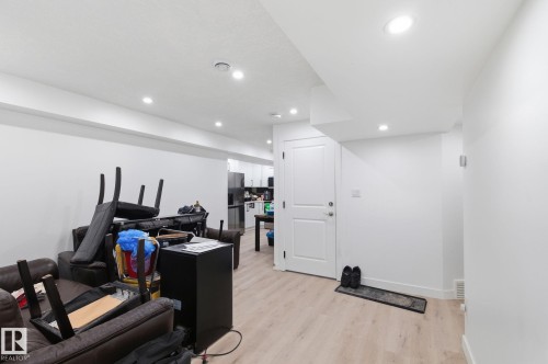 Office space with light wood-style flooring and recessed lighting - 13538 127 Street, Edmonton, AB - Indoor Photo Showing Other Room