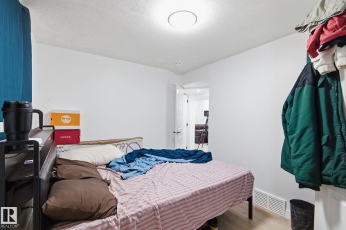 Bedroom featuring wood finished floors and baseboards - 13538 127 Street, Edmonton, AB - Indoor Photo Showing Bedroom