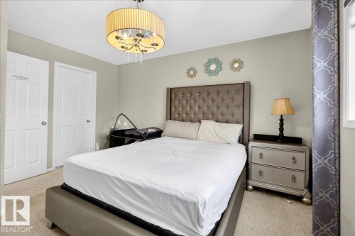Bedroom with light colored carpet - 47 230 Edwards Drive, Edmonton, AB - Indoor Photo Showing Bedroom