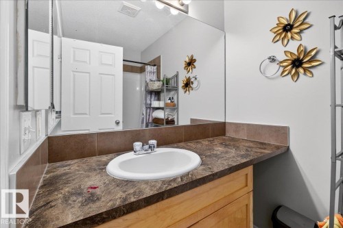 Full bath featuring vanity and curtained shower - 47 230 Edwards Drive, Edmonton, AB - Indoor Photo Showing Bathroom