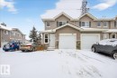 Traditional-style home with stone siding and an attached garage - 47 230 Edwards Drive, Edmonton, AB  - Outdoor With Facade 