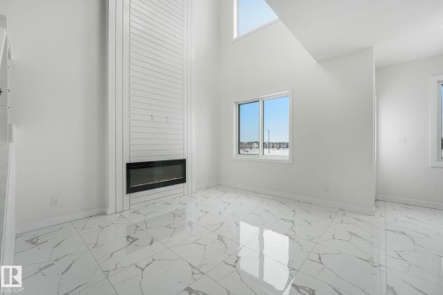 922 15 Avenue, Edmonton, AB - Indoor Photo Showing Other Room With Fireplace